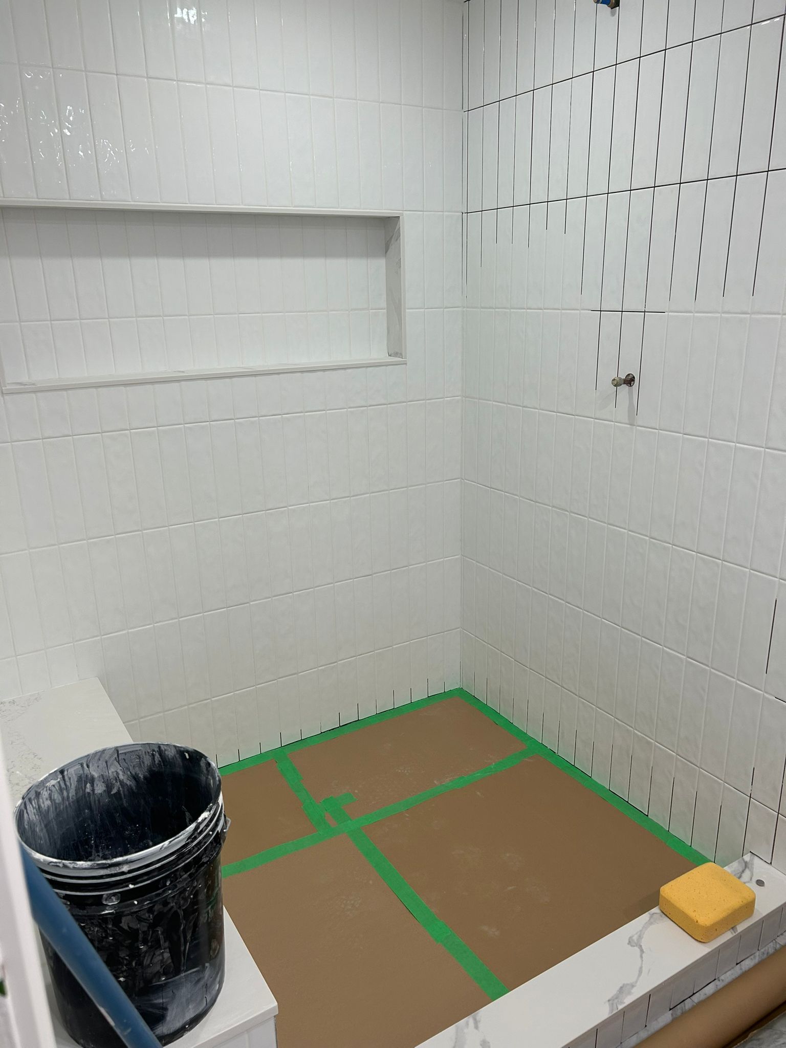 Shower tile installation in progress