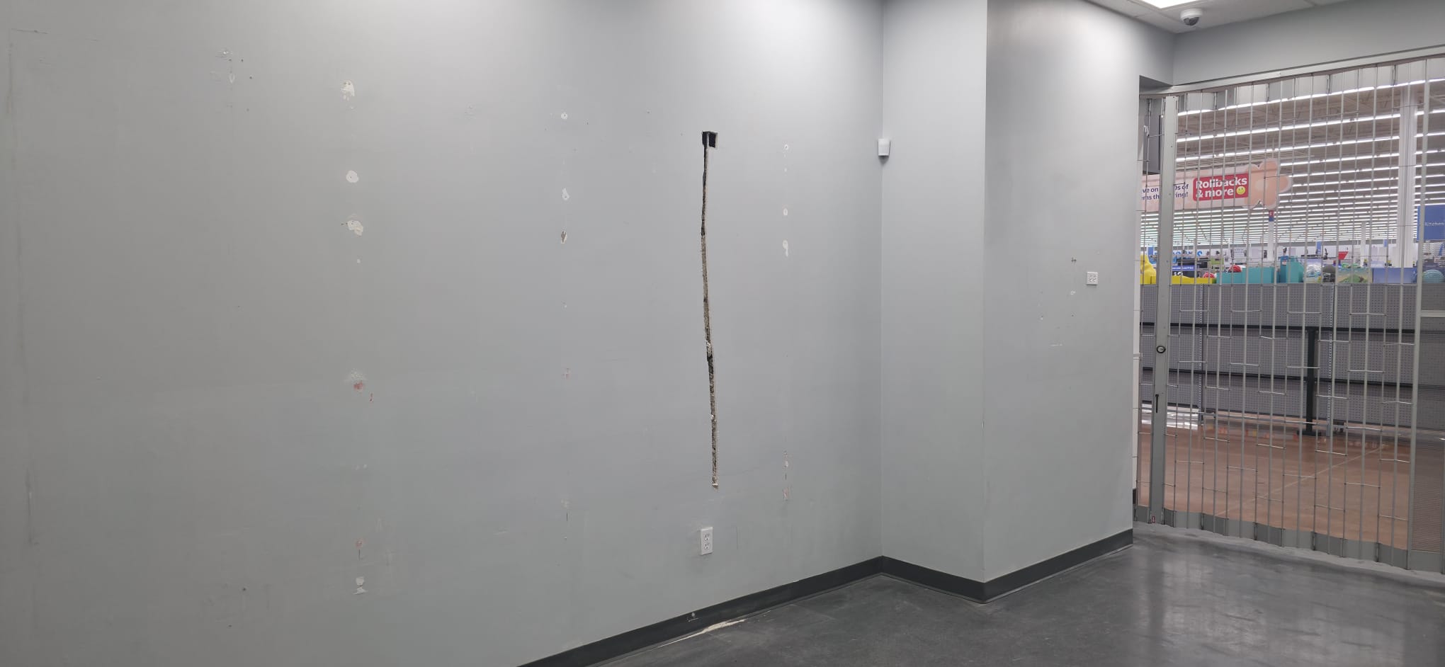 Commercial interior before wall repair and refinishing