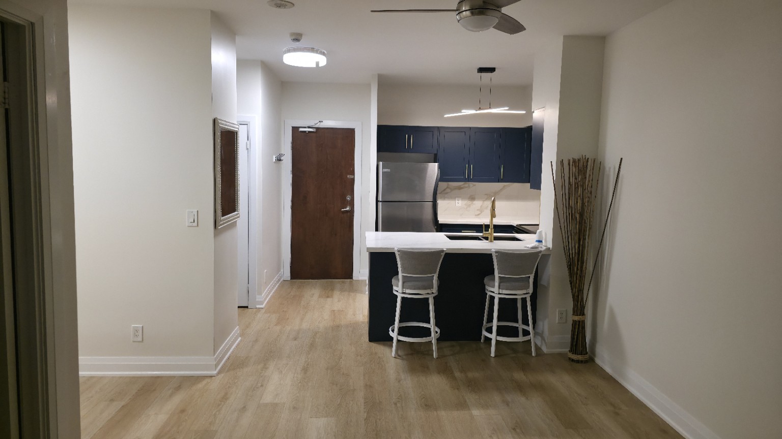 Completed condominium kitchen and living space following AMN water-damage reconstruction