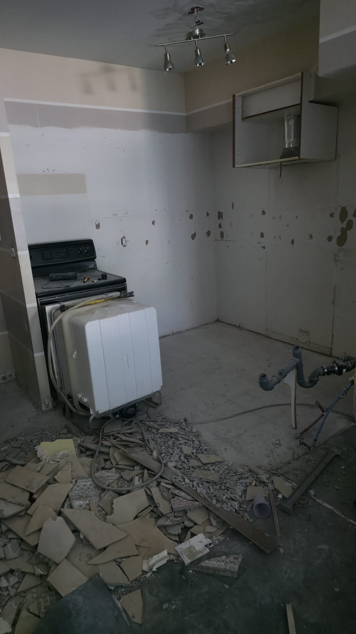 Condominium interior during water-damage restoration and reconstruction after a main building riser loss